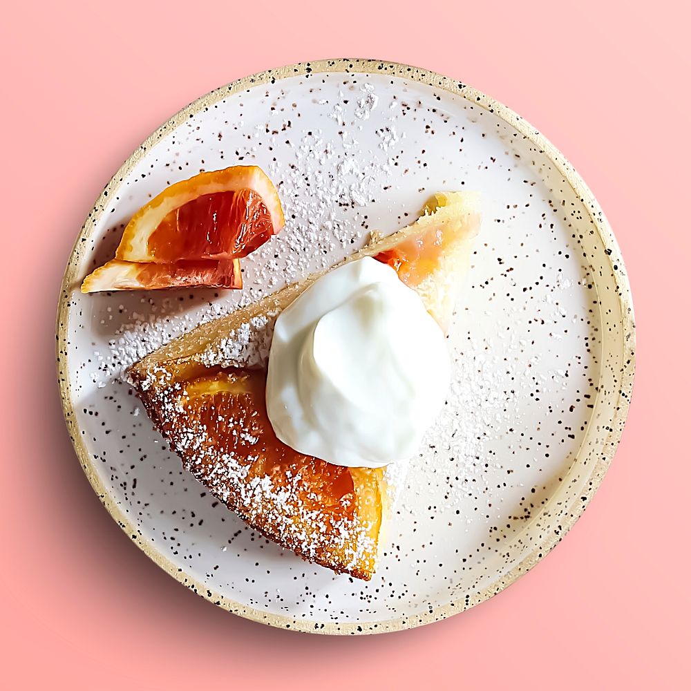Orange cake slice on a plate, food photography, flat lay style
