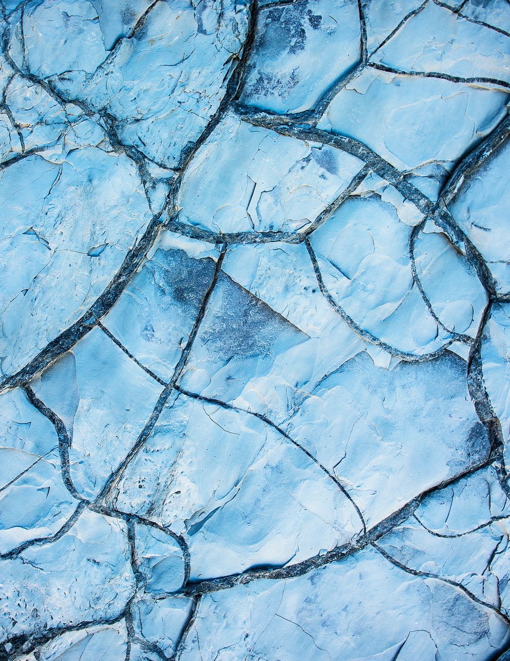 Blue background, cracked rock texture