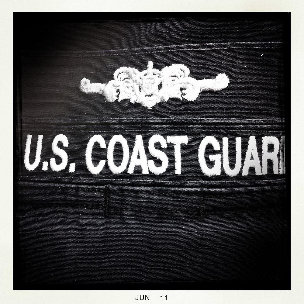 110620-G-EM820-076 (Hipstamatic)A cutterman pin and a service tape tape is sewn on a Coast Guard uniform Monday, June 20…