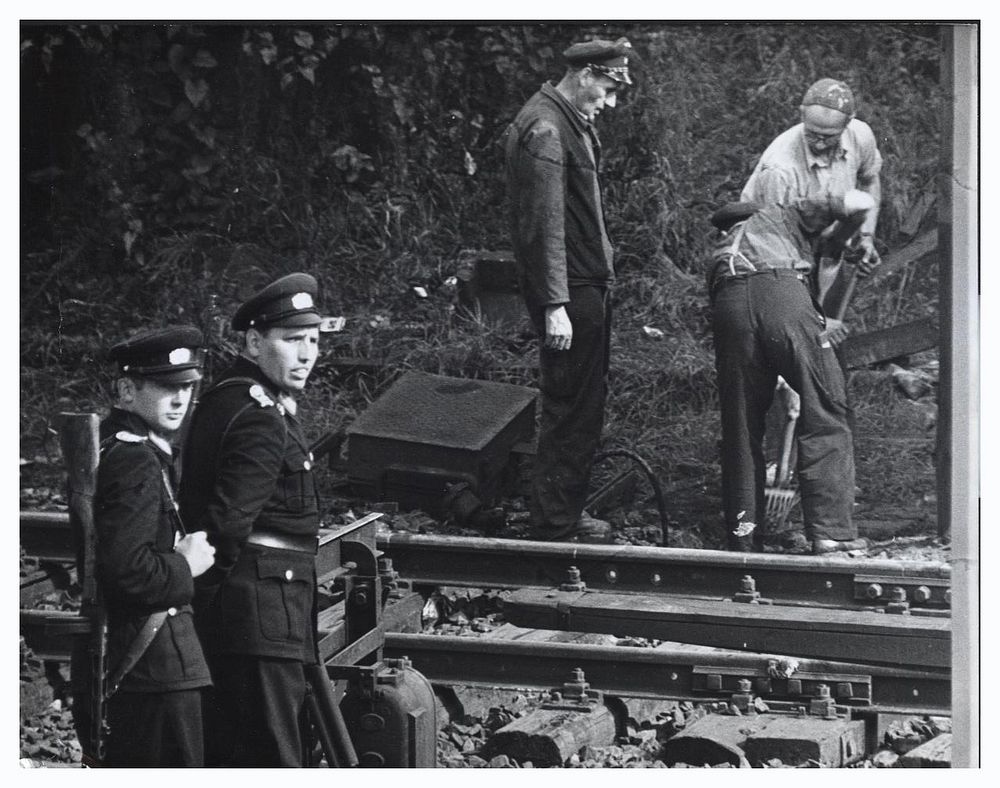 East German Construction WorkersSept. 28, 1961. Heavily guarded East German construction workers demolish train tracks…