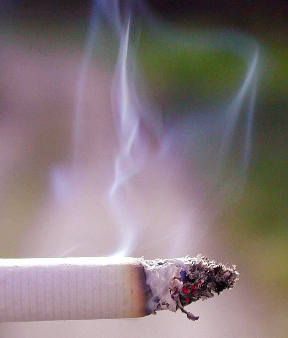 Cigarette with smoke. Free public domain CC0 photo.
