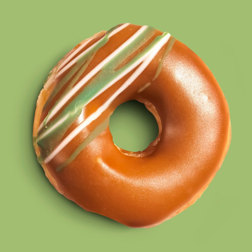 Ring glazed donut on green background, food photography
