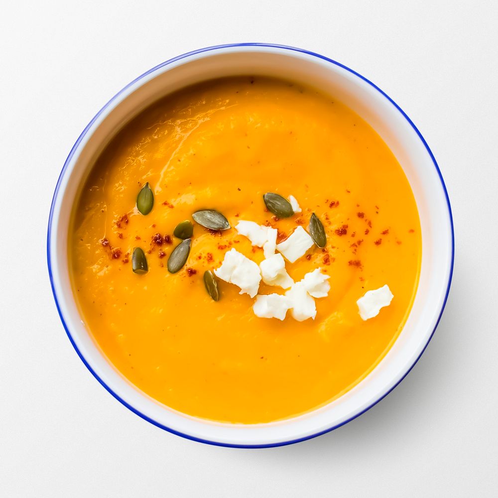 Pumpkin soup in a bowl, food photography, flat lay style