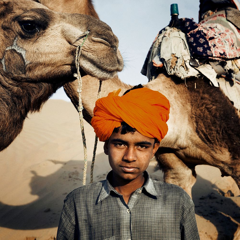 Indian boy with his camels