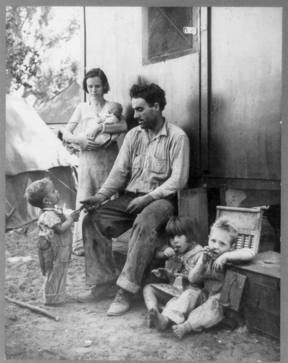 Texas tenant farmer in Marysville, California, migrant camp during the peach season. 1927 made seven thousand dollars in…