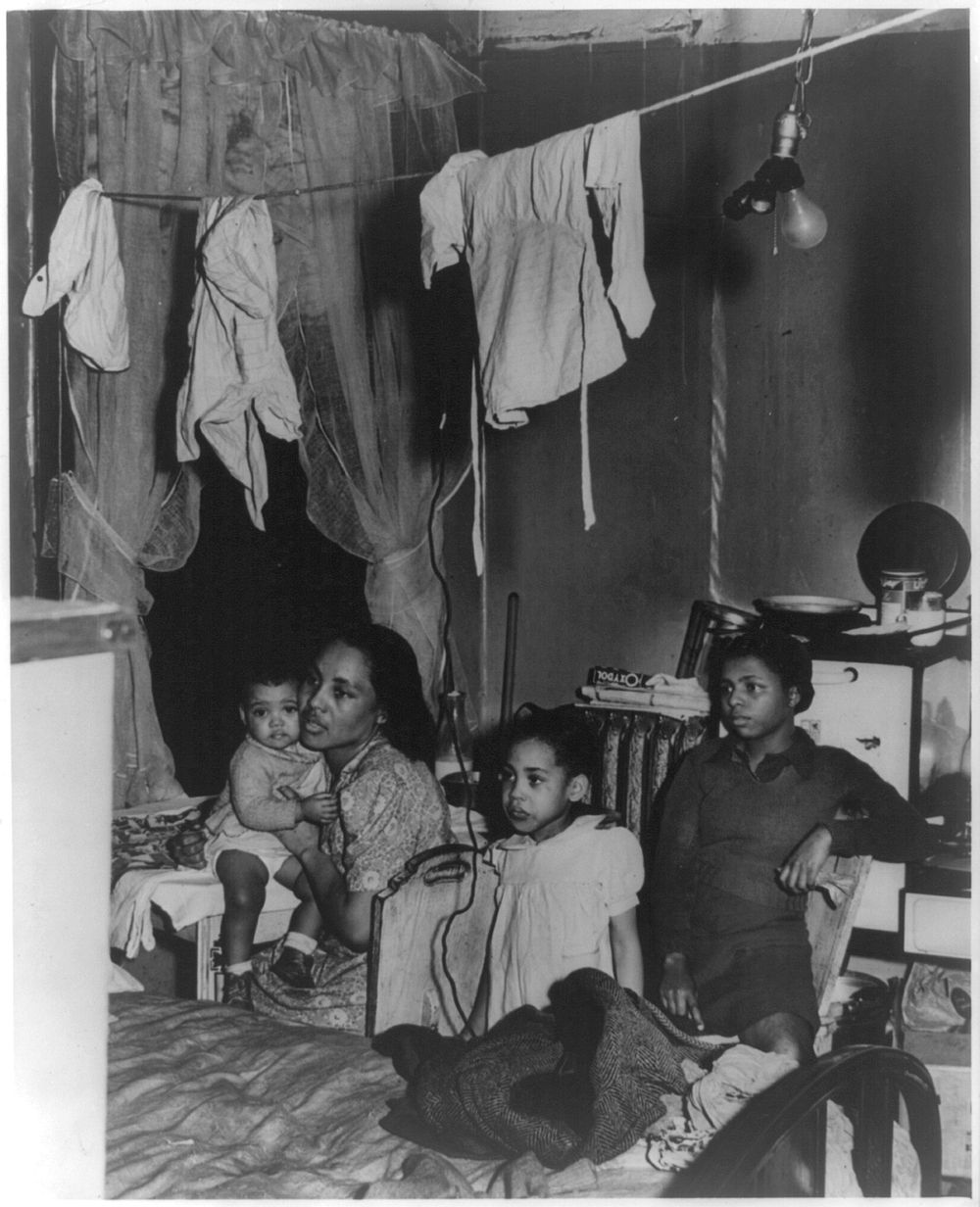 [African-American family living in crowded quarters, Chicago, Illinois] by Russell Lee