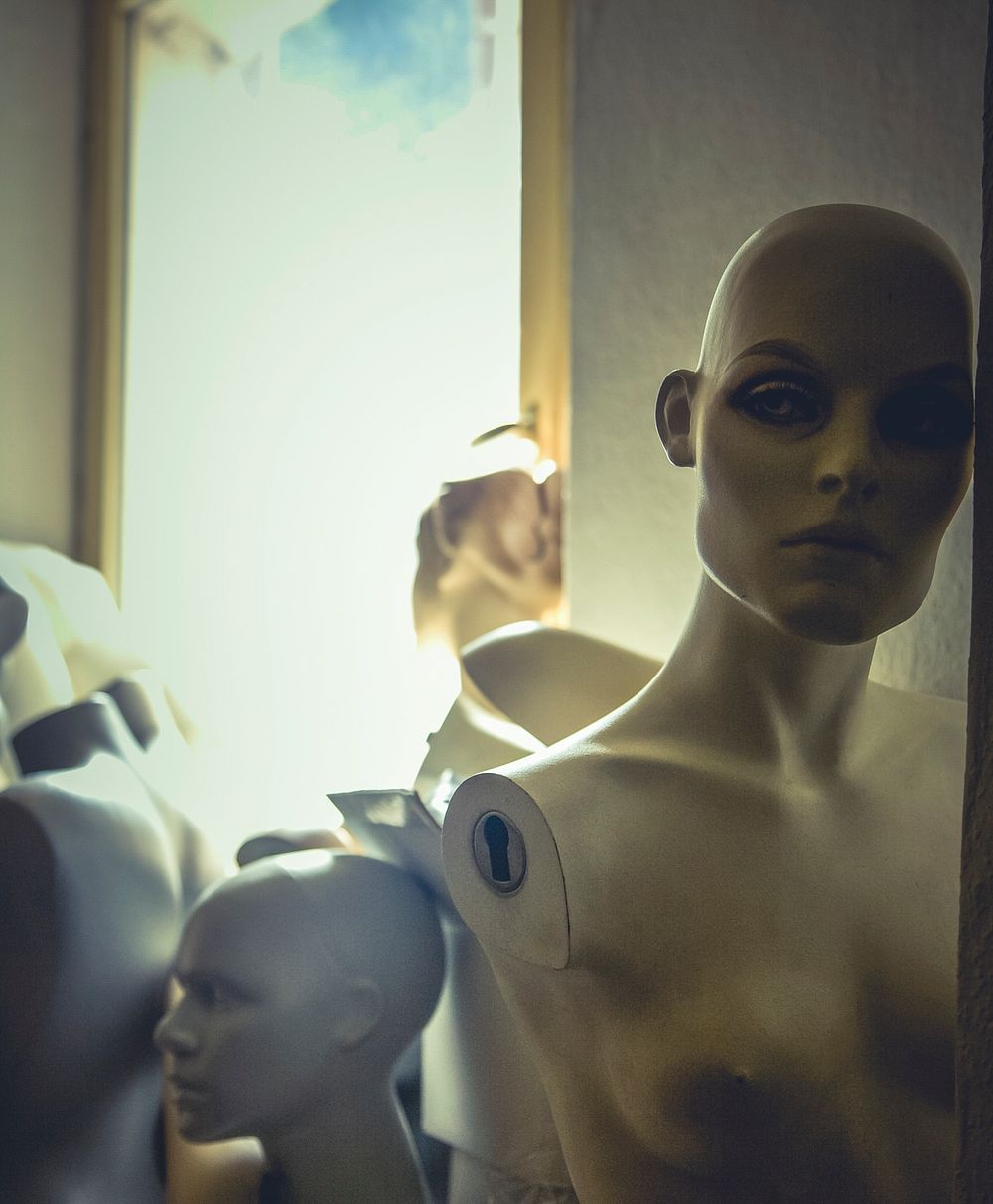 Lifelike mannequins in a storage room