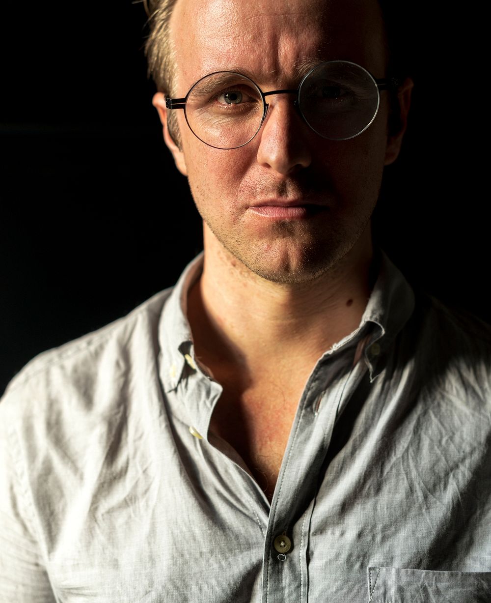 Closeup portrait of a guy wearing glasses