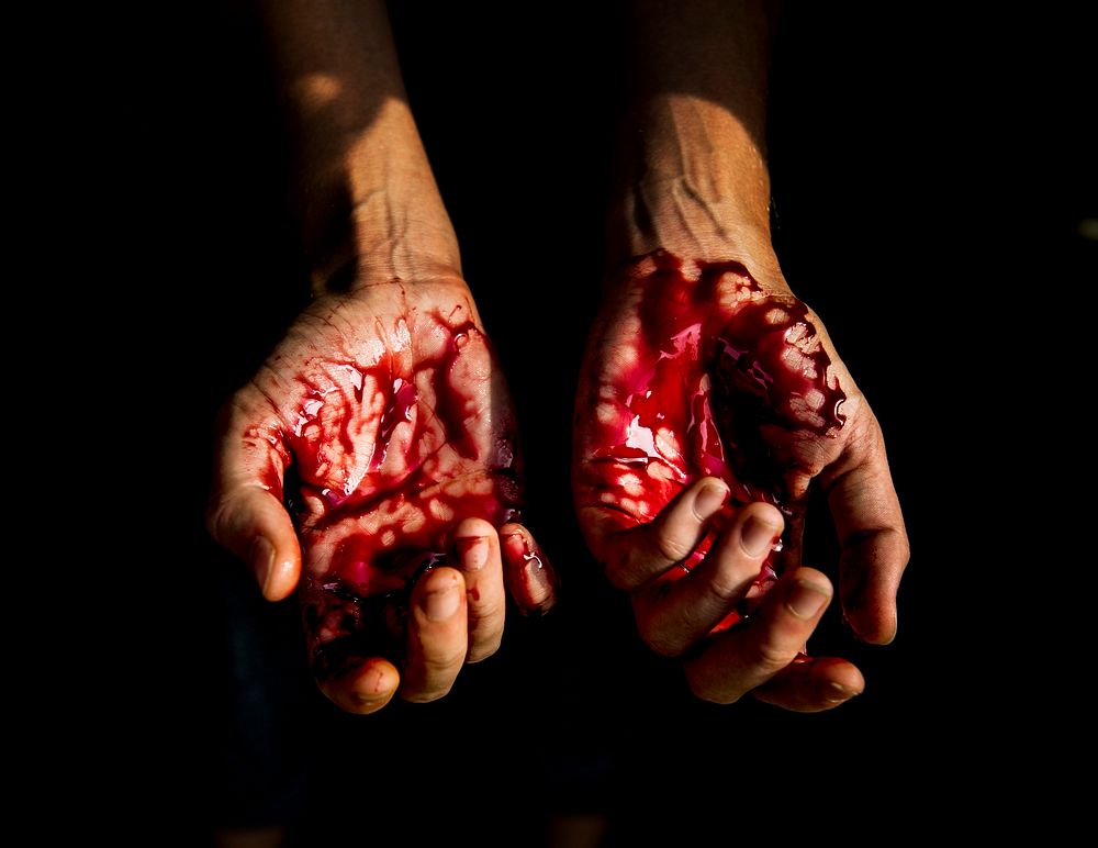 Bloody hands with black background