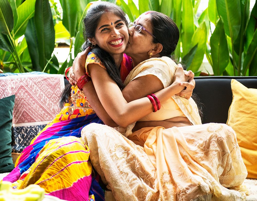 Happy Indian mother and daughter hugging each other