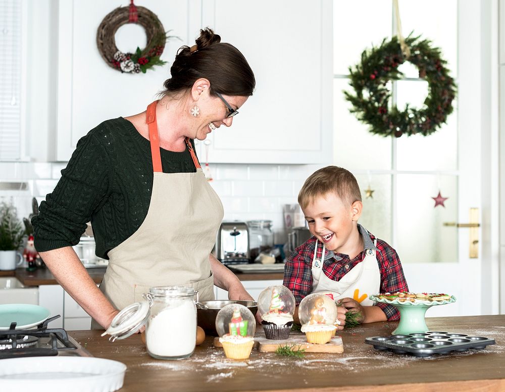 Mother and son baking for Christmas in the kitchen