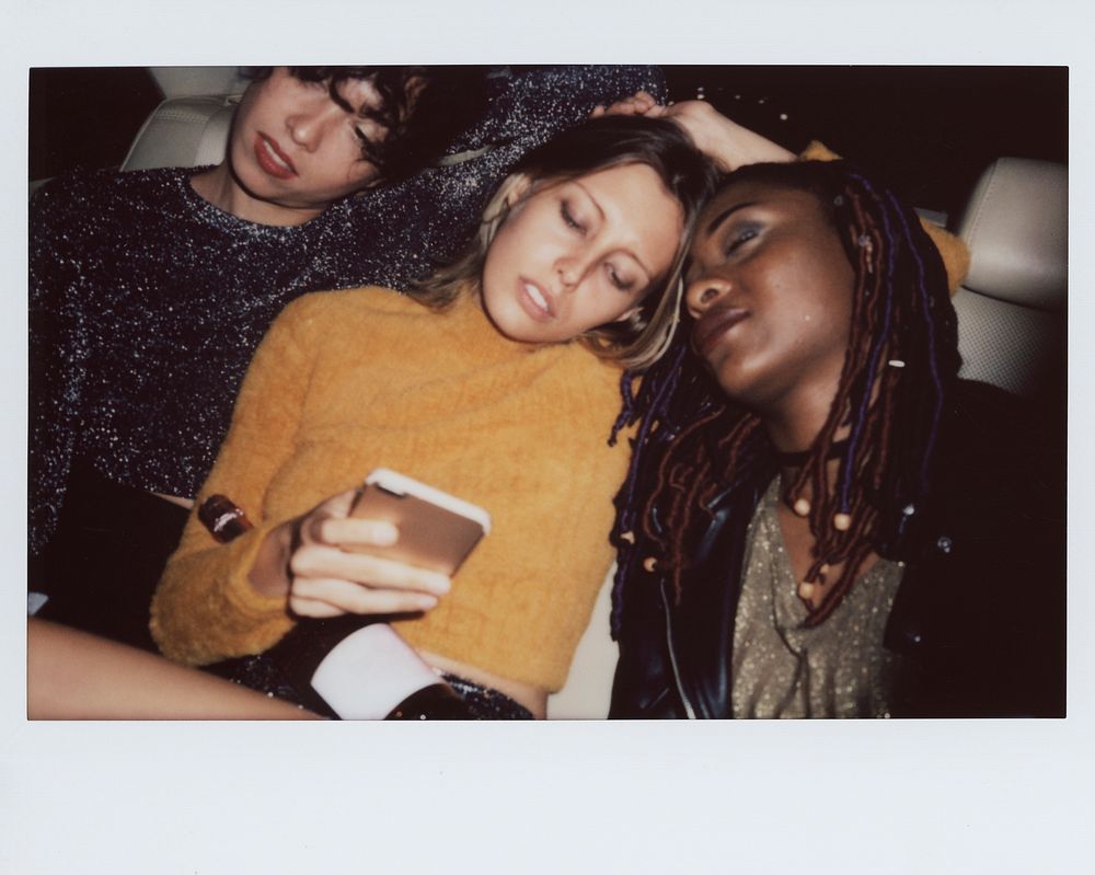Diverse women in a backseat of a cab
