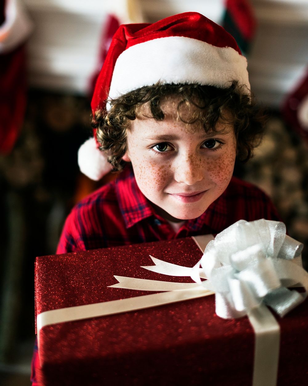 Young Caucasian boy with Christmas present box