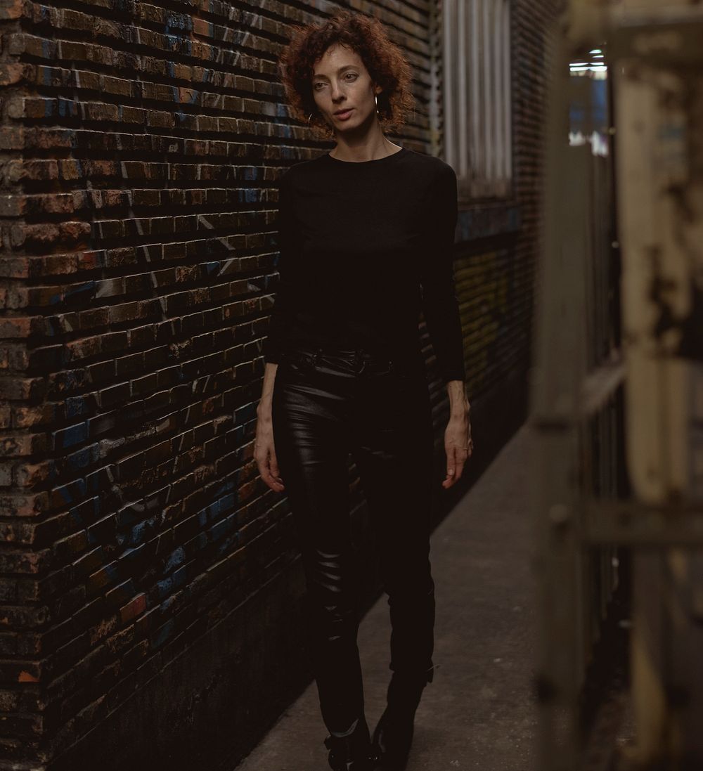 Woman walking through an alley
