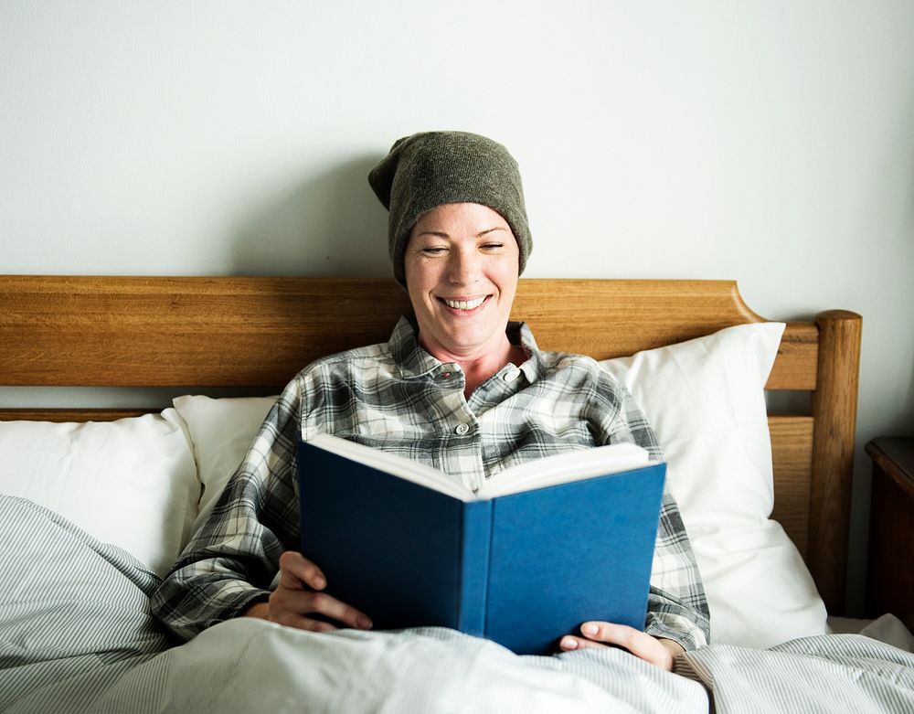 Patient reading in bed