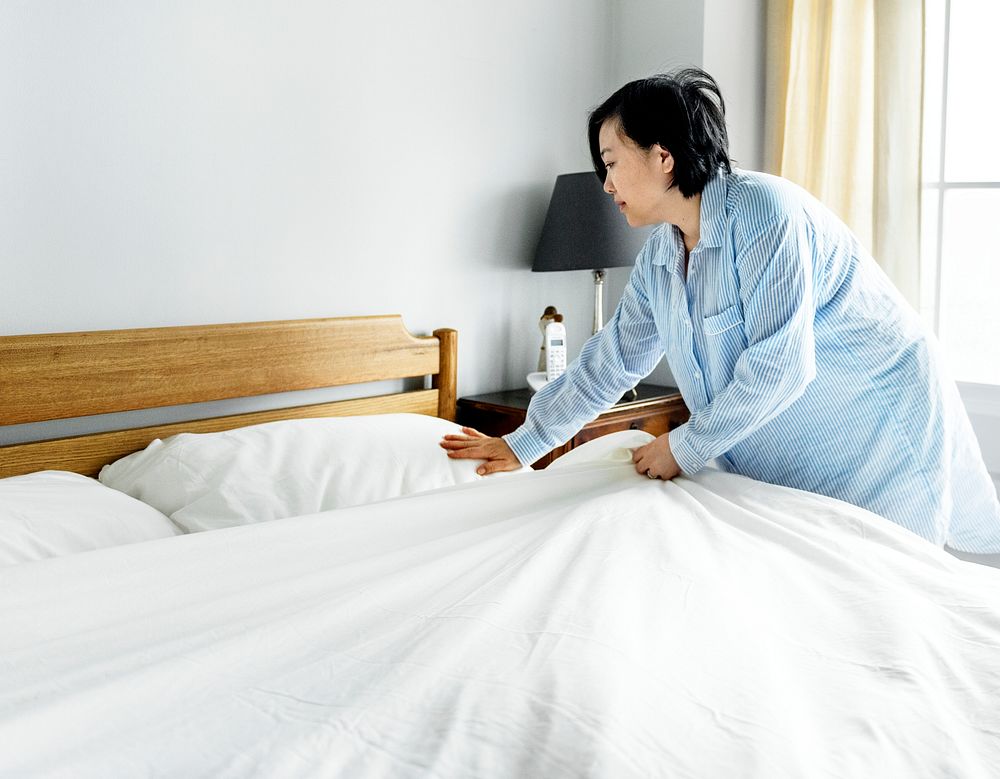 A woman making bed
