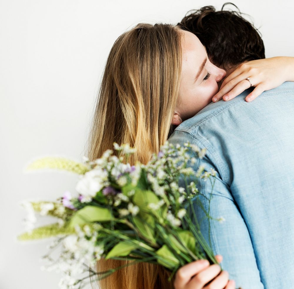 Woman receive a bouquet of flower from her lover