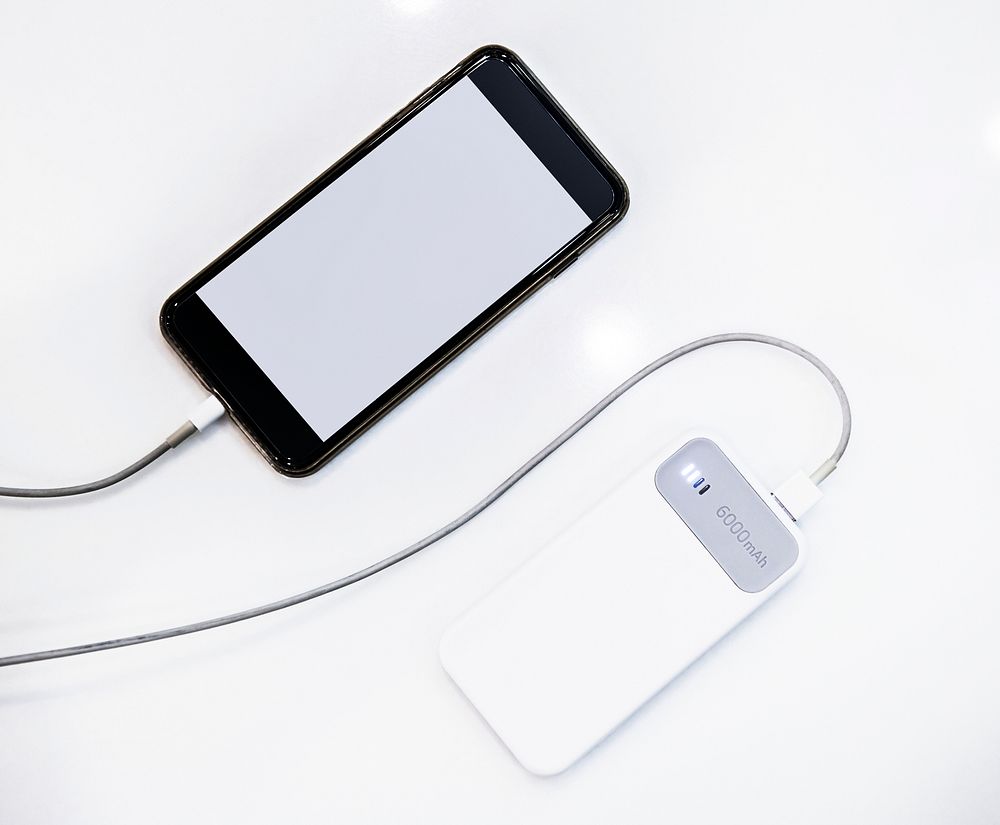 Smartphone being charged using a power bank