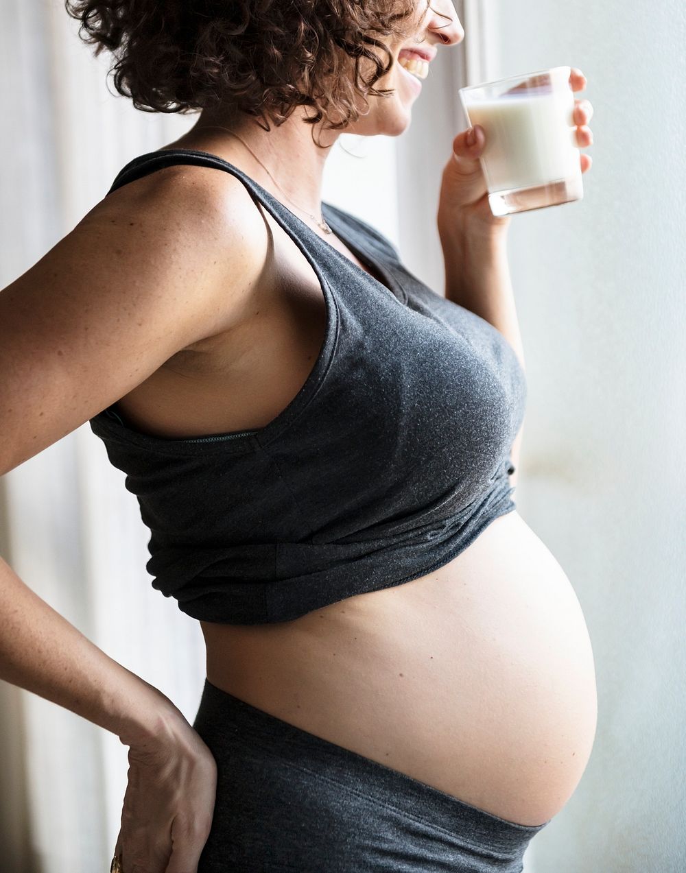 Woman drinking milk during her pregnancy