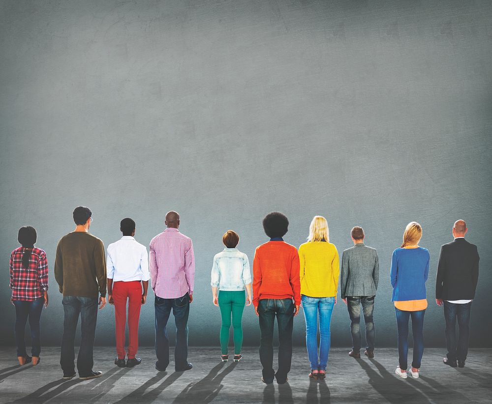 Rear view of diverse people standing together