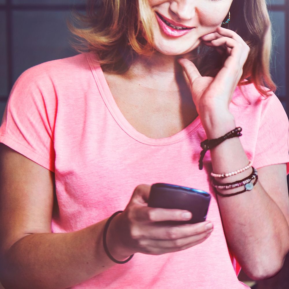 Caucasian woman is using mobile phone