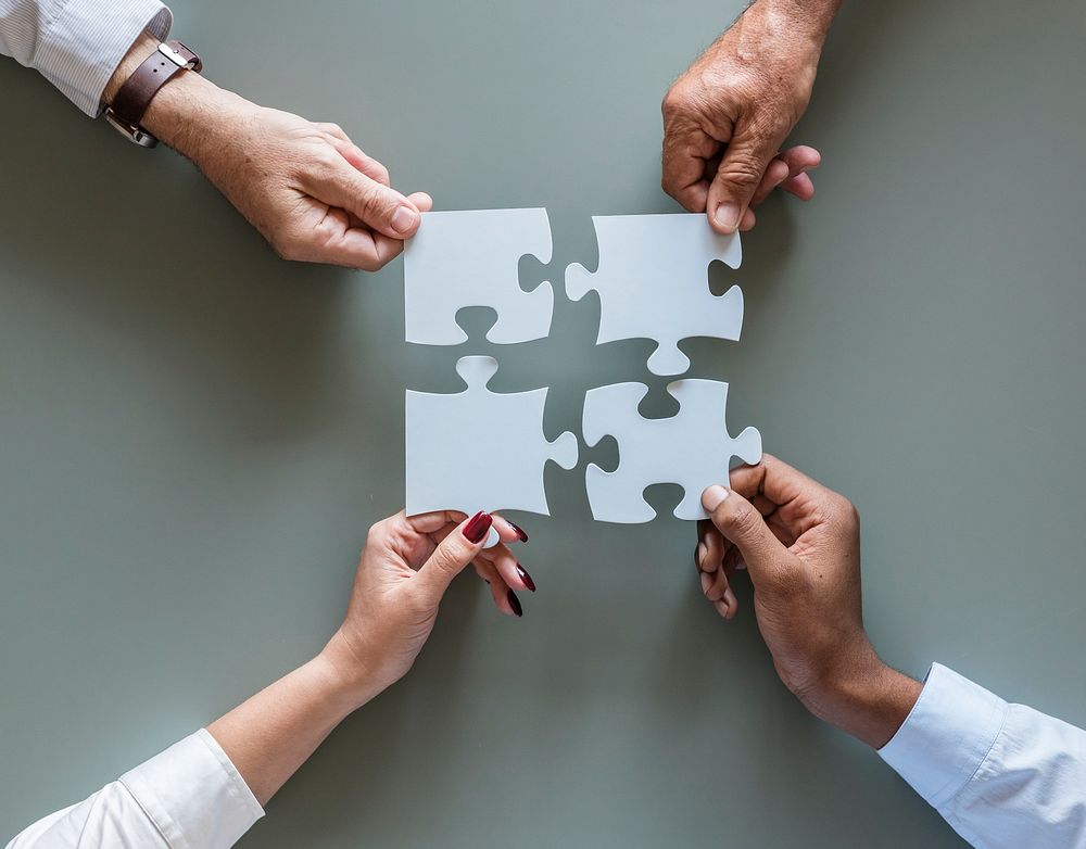 Business teamwork cooperation jigsaw isolated