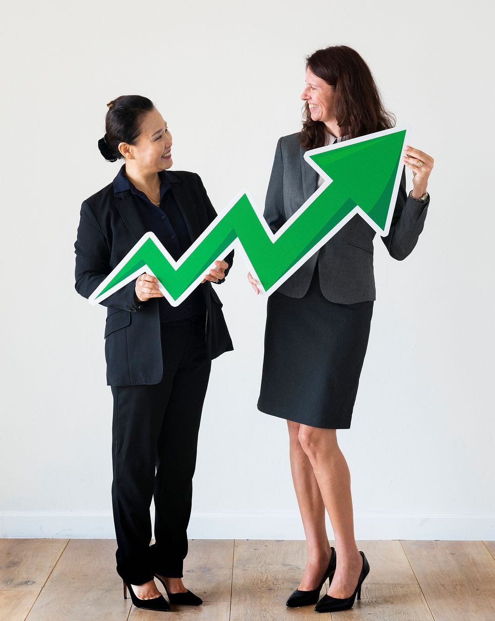 Businesswomen holding profit statistics icon