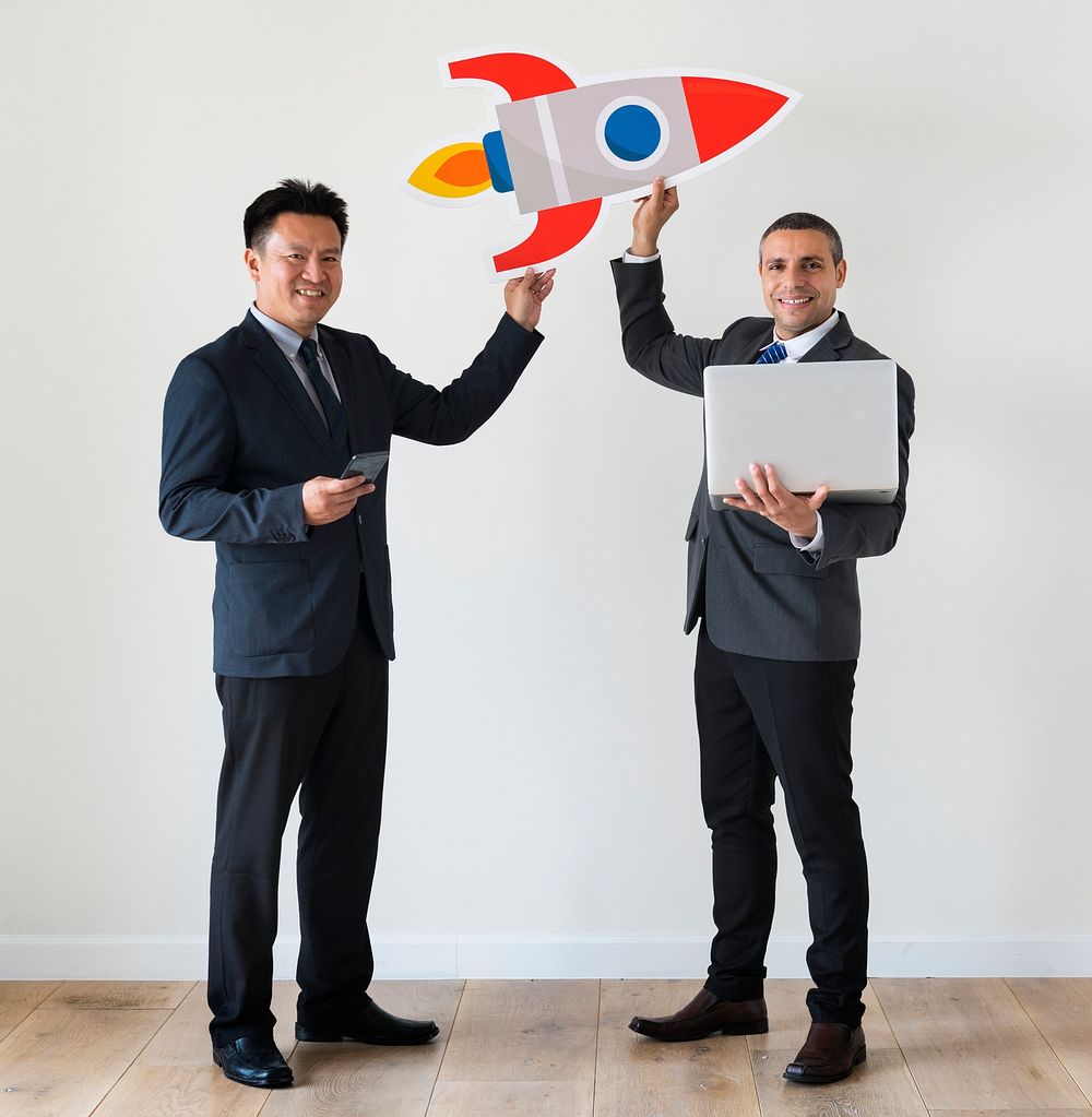 Businessmen holding rocket icon
