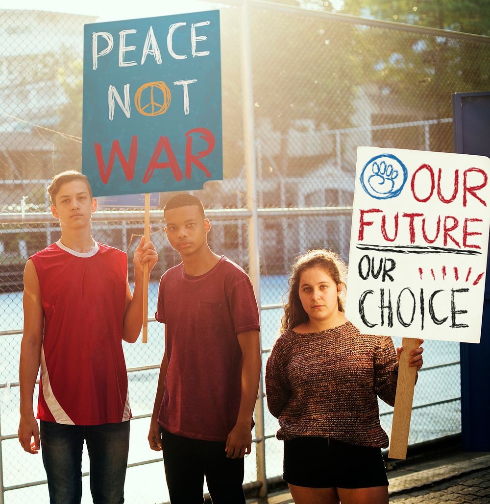 Group of diverse teenagers protesting anti war