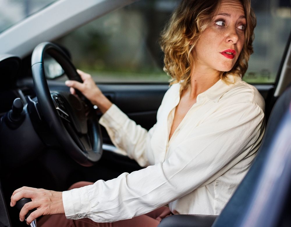 Woman driving a car in reverse