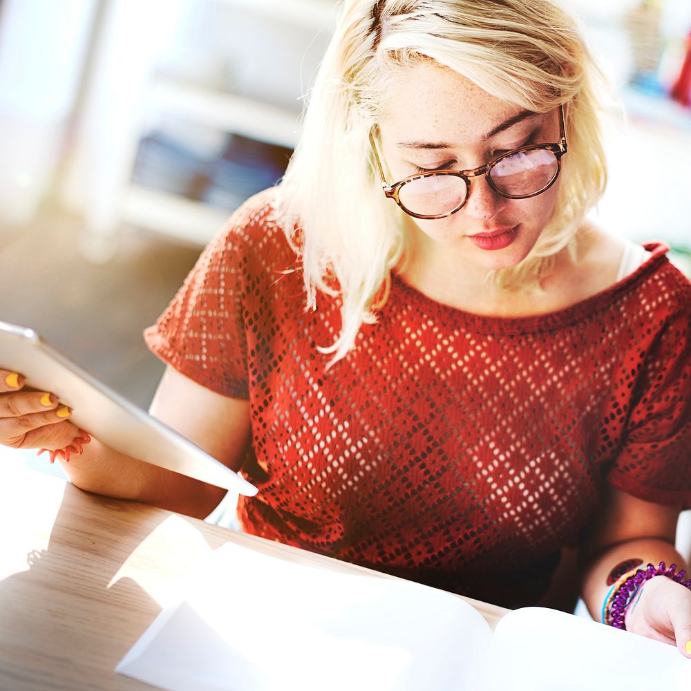 Blonde woman busy studying