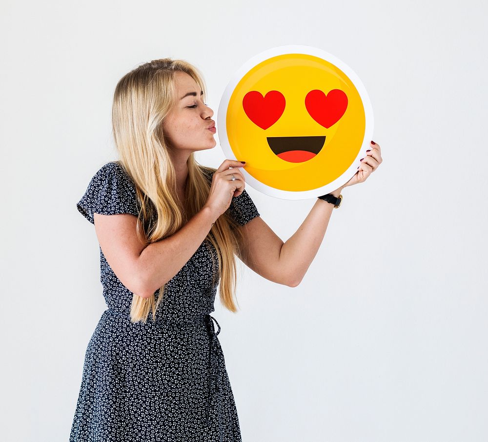 Woman showing falling in love emoticon
