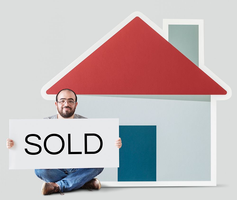 Man holding poster with house mockup