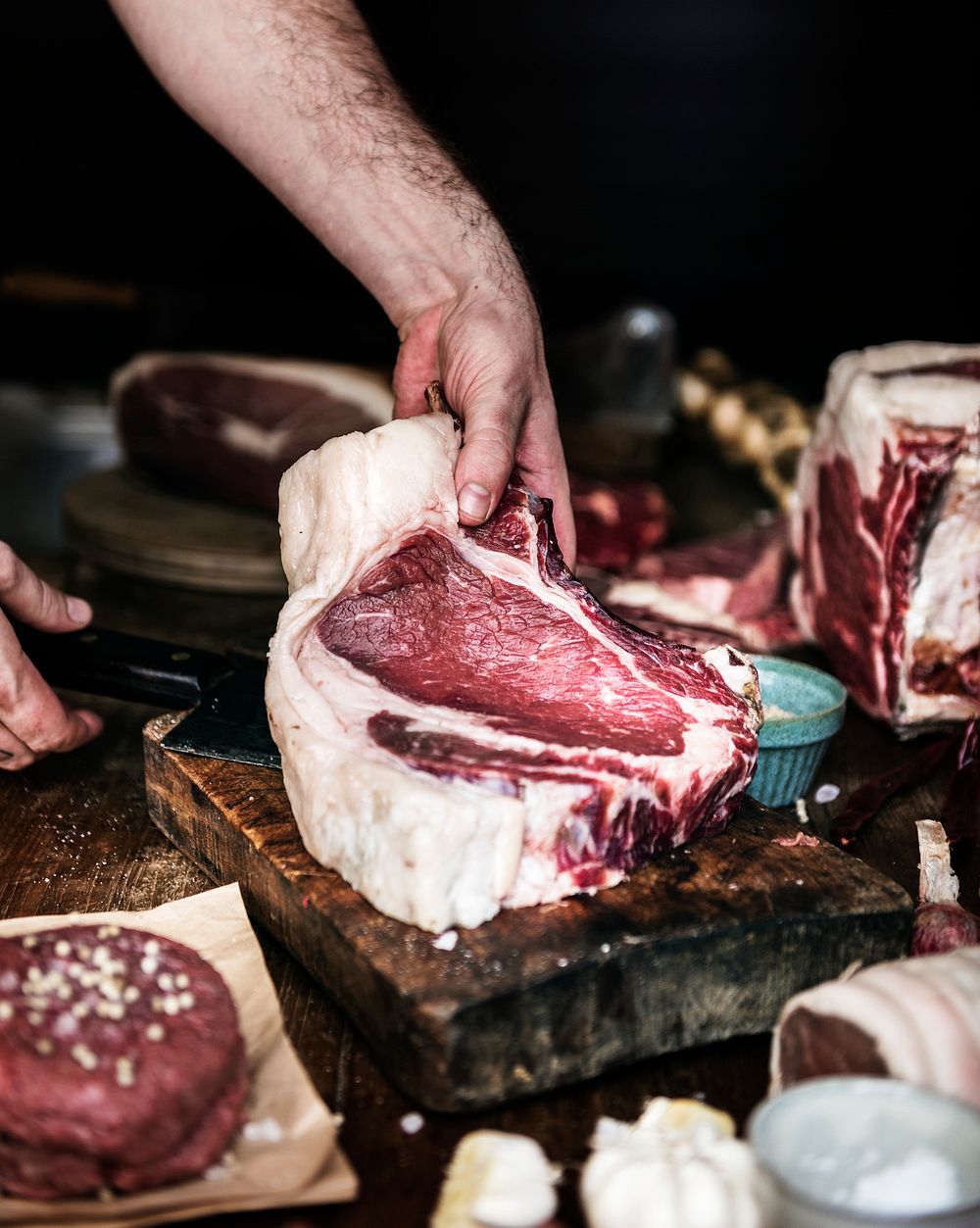 Raw beef tomahawk steak on dark background Vector Image