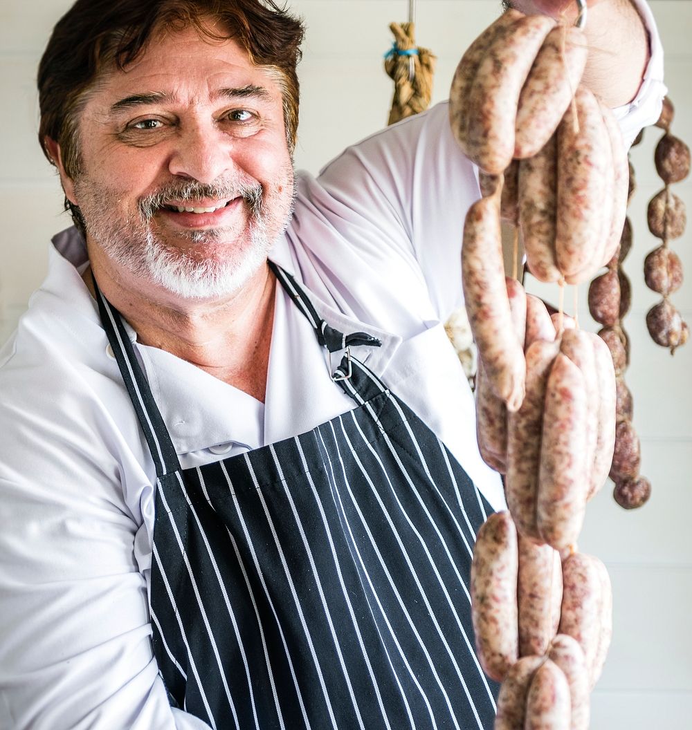 Butcher selling sausages on a string