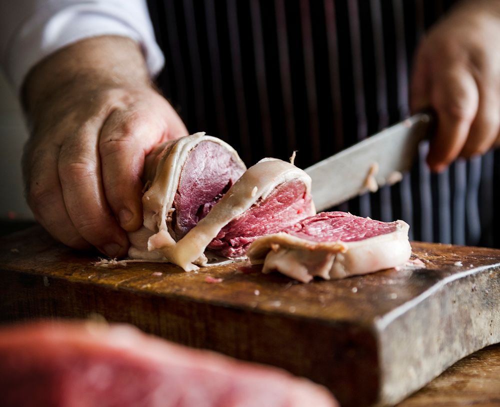 Butcher slicing a steak food photography recipe idea