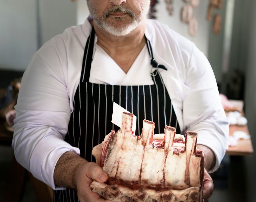 Butcher selling meat in a butcher shop food photography recipe idea