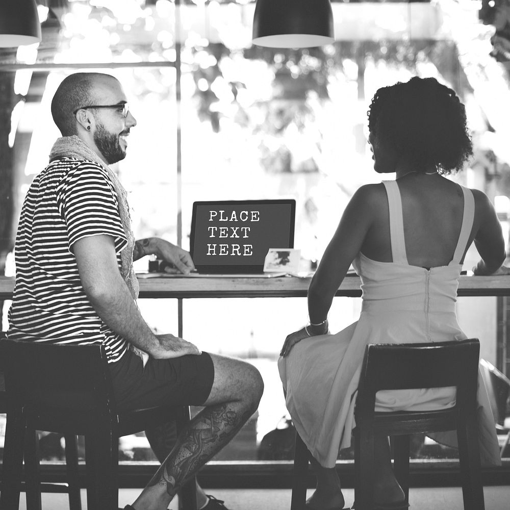 Guy and woman in a cafe
