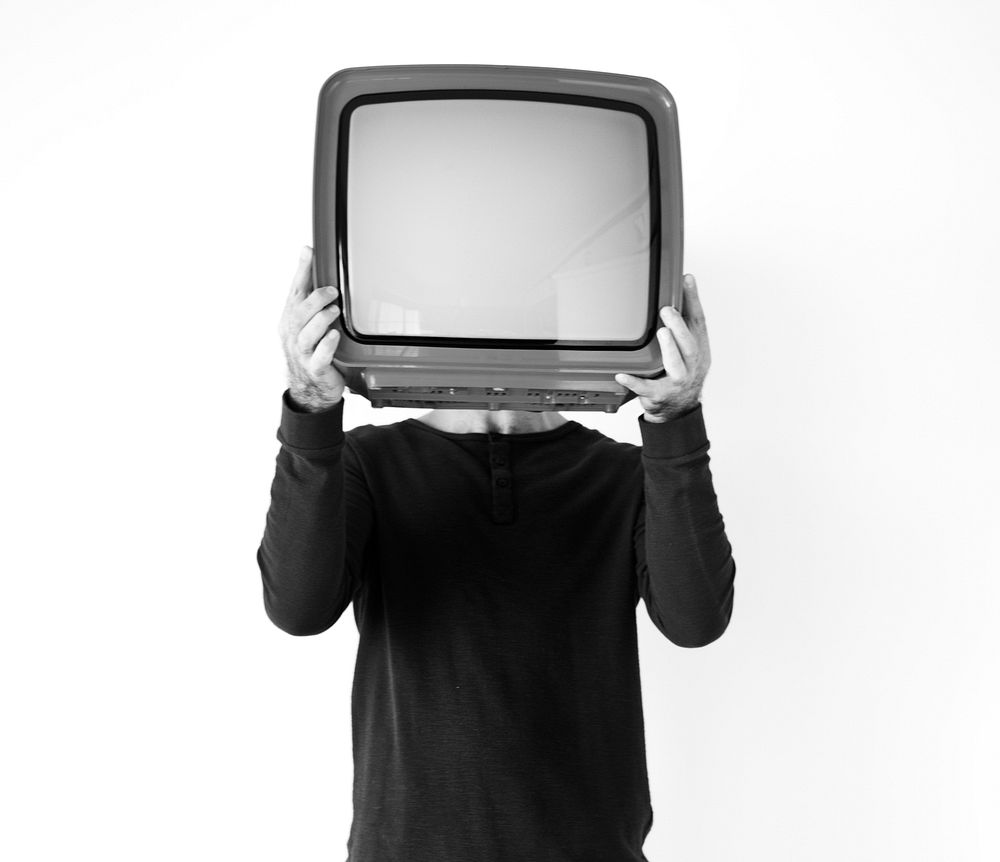Closeup of man holding a TV