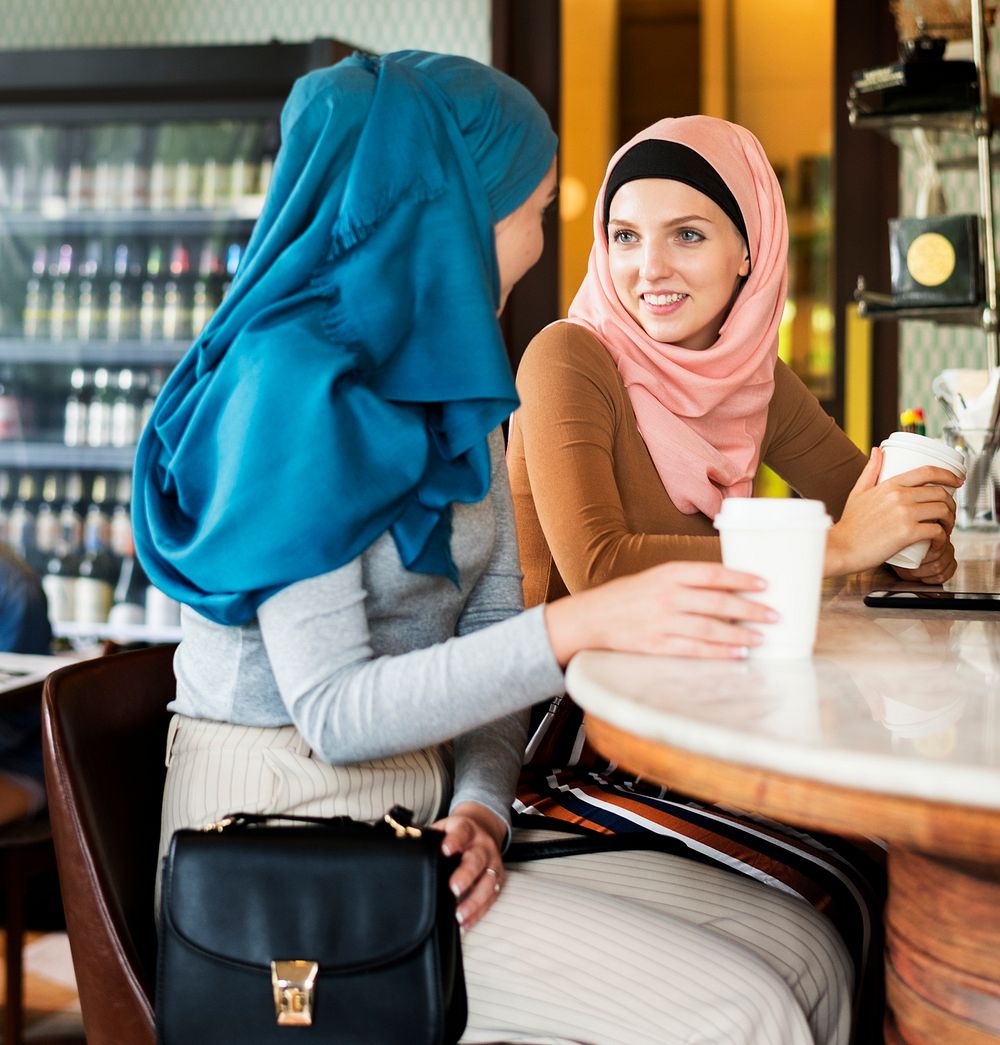 Muslim women enjoying and talking in the coffee shop