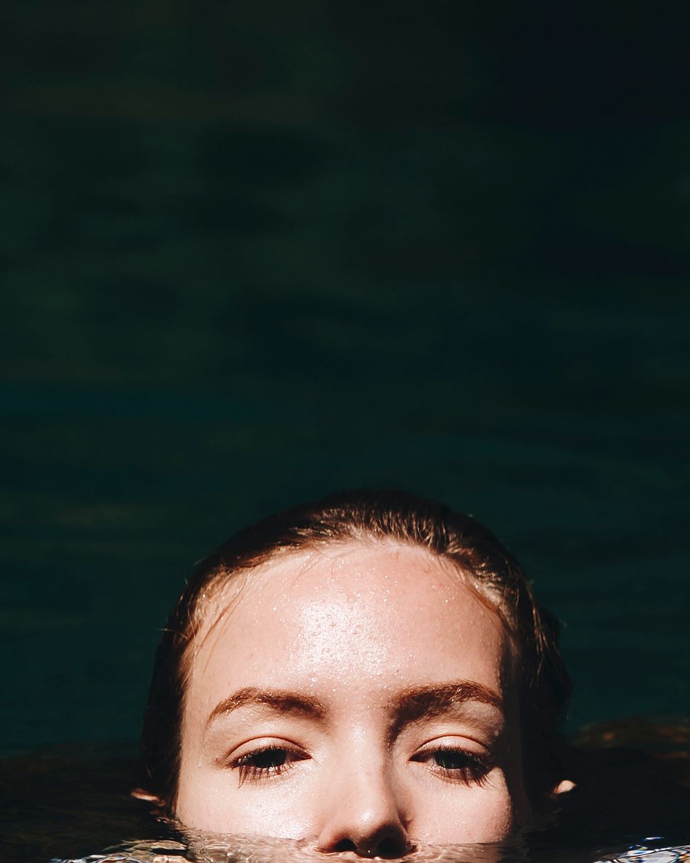 Portrait of a beautiful woman under water
