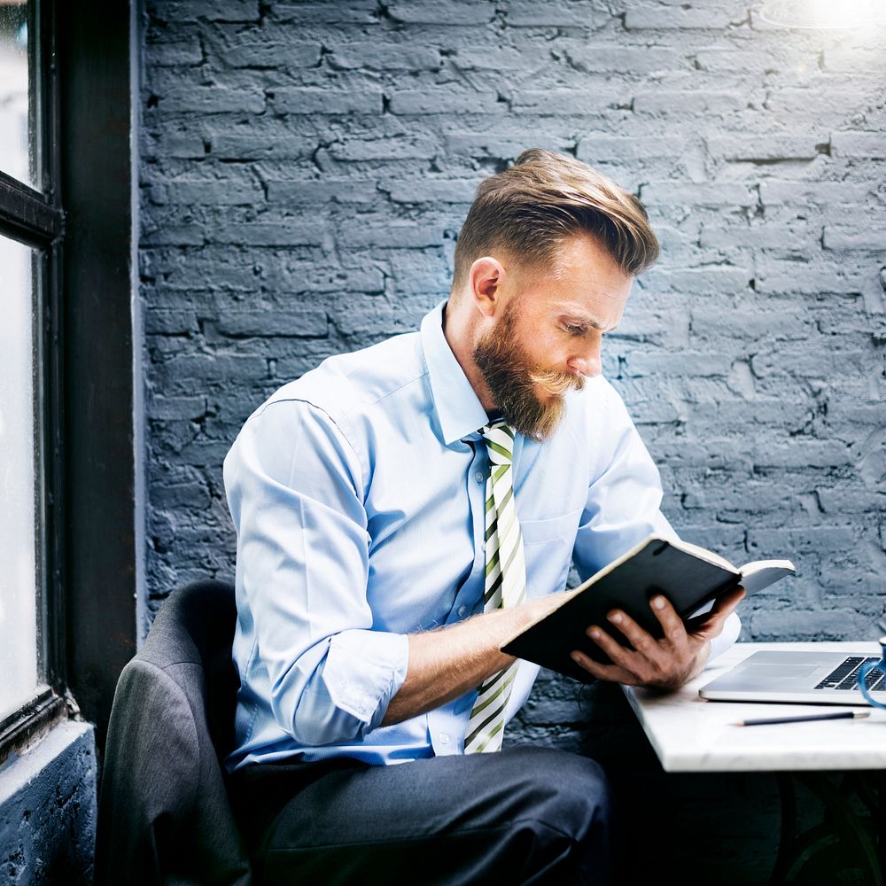 Businessman reading in office setting