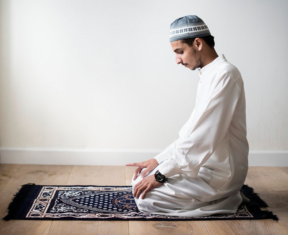 Muslim praying in Tashahhud posture