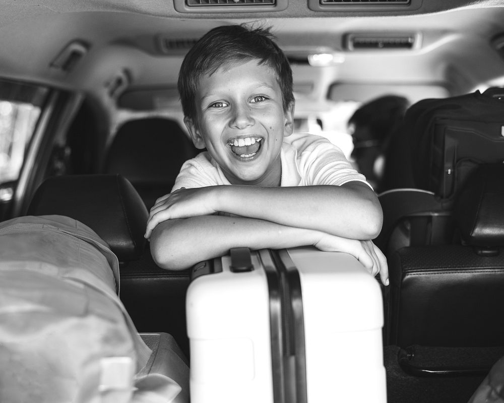 Little boy going on a holiday by car