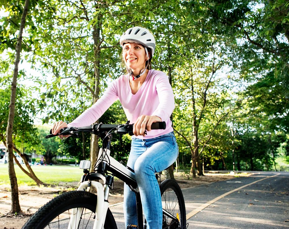 Woman enjoying a bicycle ride in the park