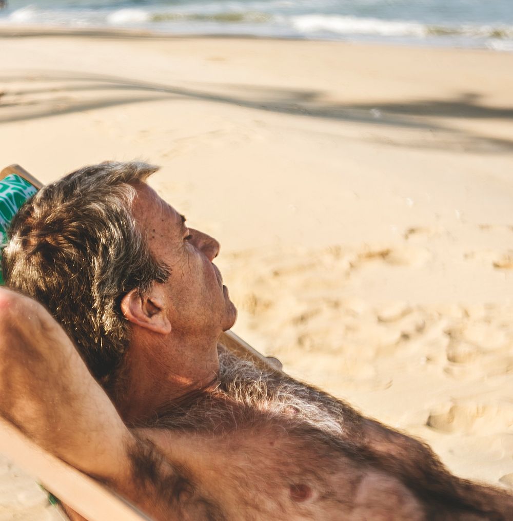 Senior man chilling on the beach
