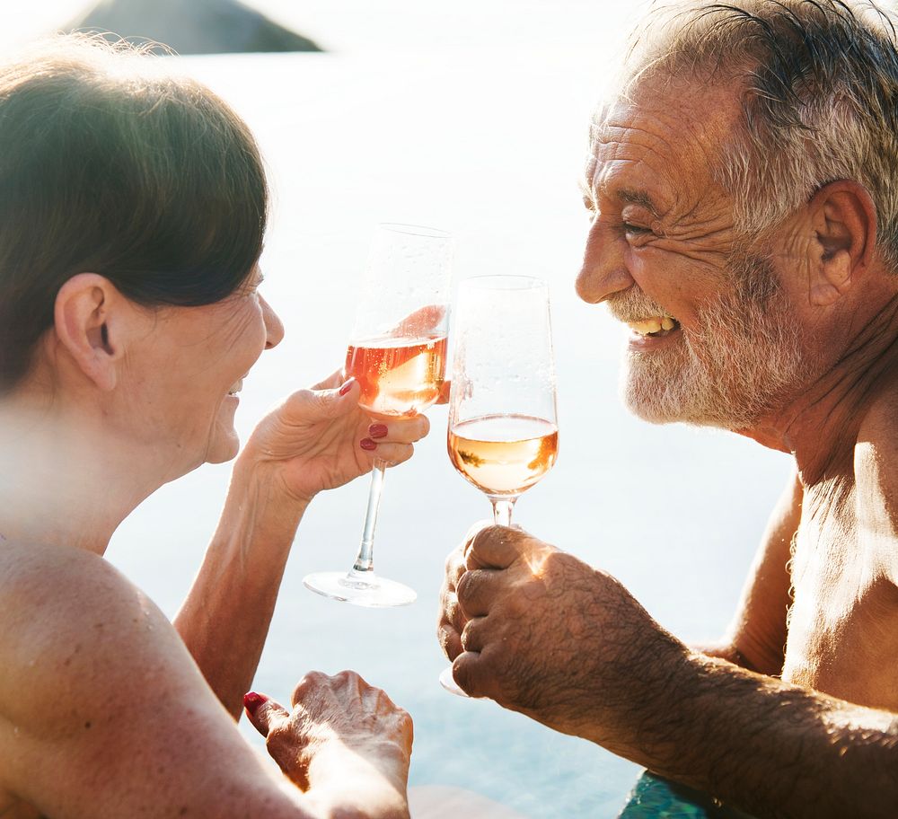 A senior couple toasting