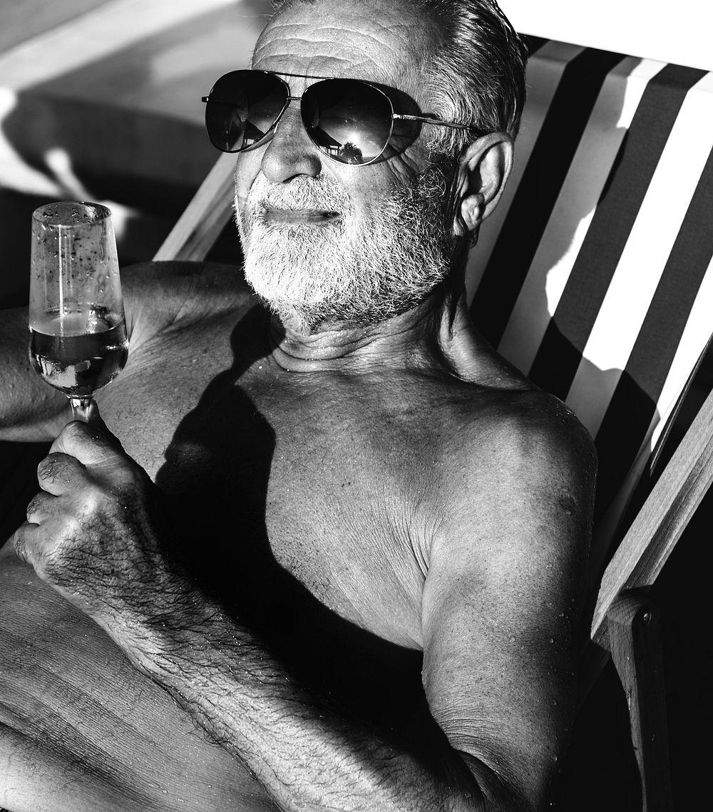 Senior man enjoying a glass of alcohol