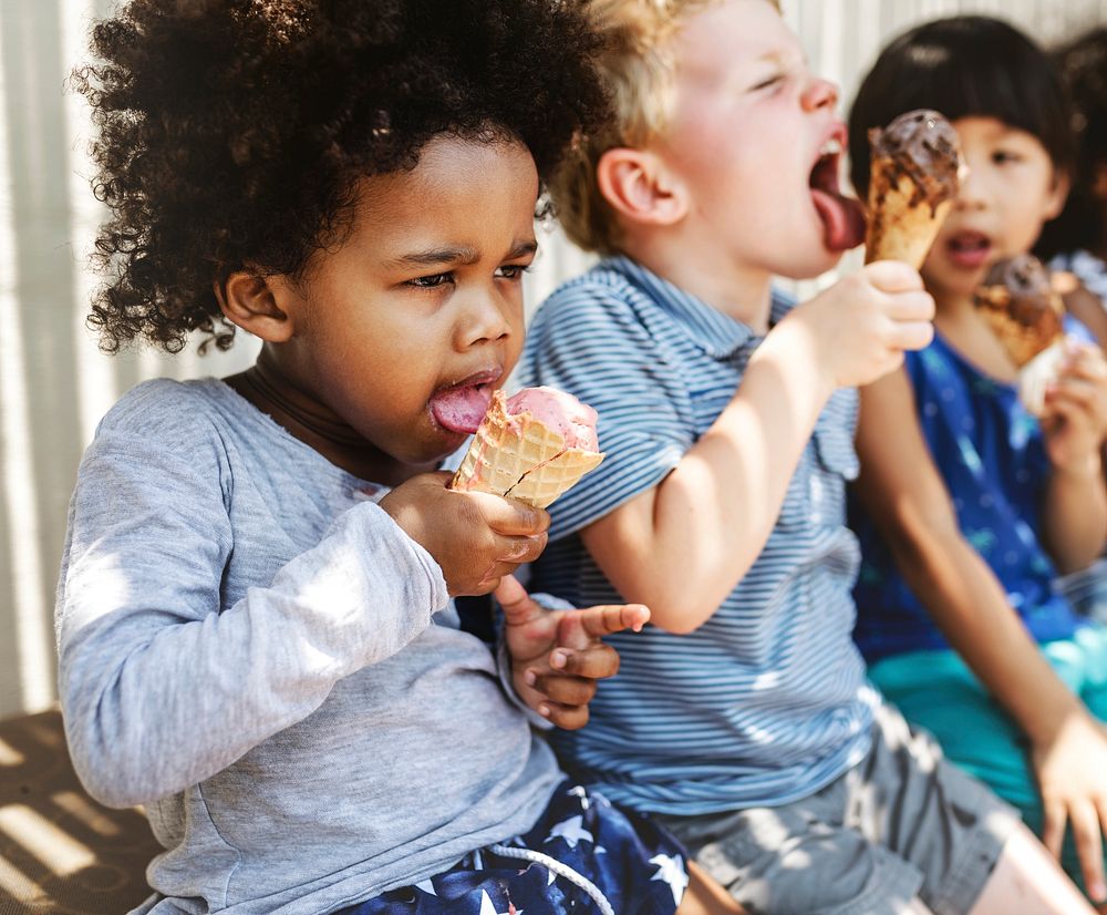 Kids eating ice cream in the summer