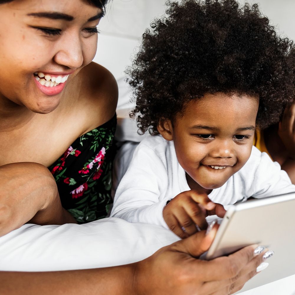 Little boy playing with a tablet